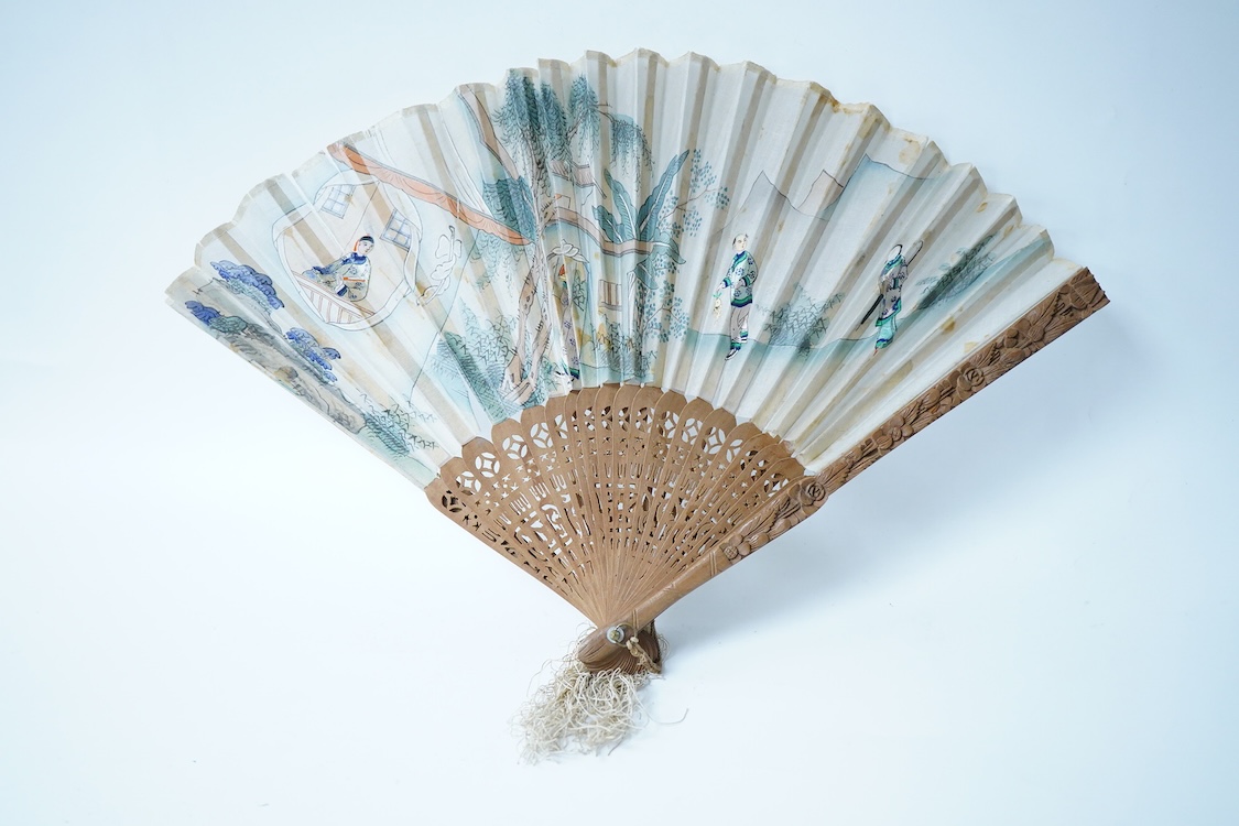 A collection of 19th century and later fans to include a black lacquered and lace example and a hand painted floral example